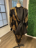 Black and gold sequin dress with oversize bow