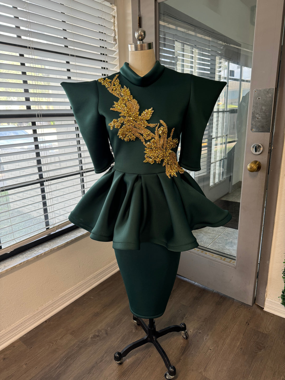 Hunter peplum with gold appliqué